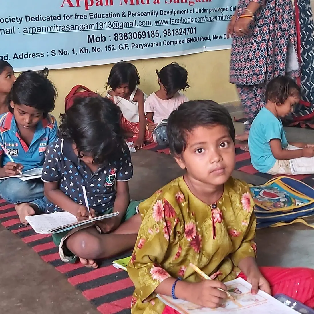 A girl writing in her notebook during a free class
