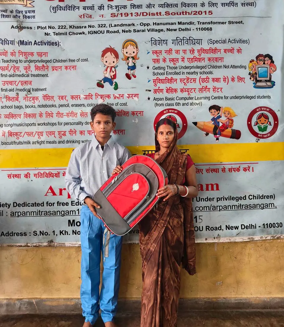 A boy receiving a new school bag