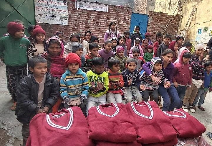 Children from the neighbourhood with their new school sweaters