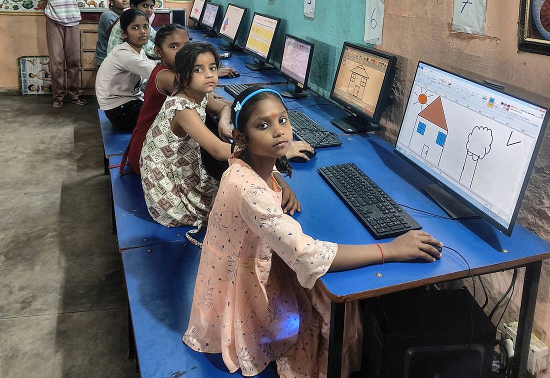 A girl drawing on a computer at the learning centre